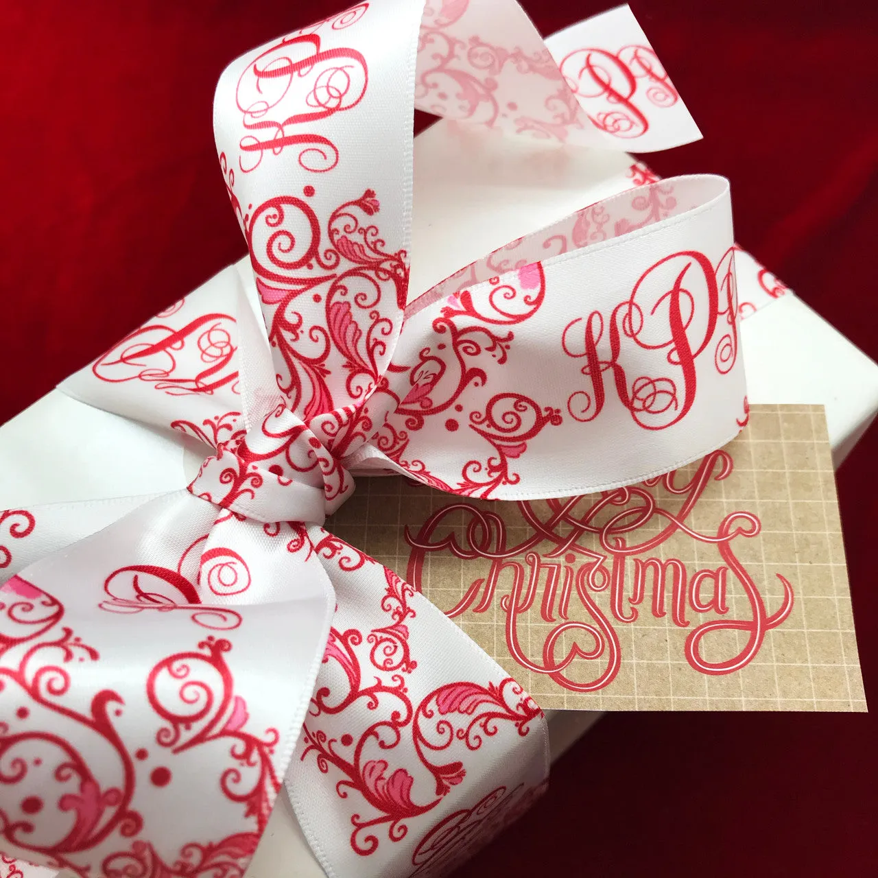 Personalized Monogram holiday ribbon in red with a red Chinoiserie design printed on 1.5"  white single face satin, 25 yards